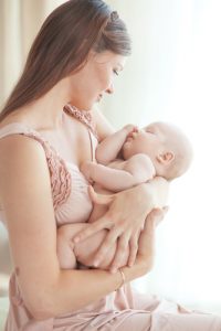 Portrait of a mother with her newborn baby