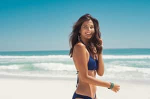 Girl Smiling On Beach